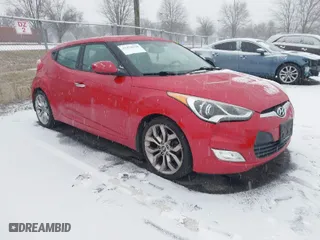 2014 Hyundai Veloster with VIN KMHTC6AD8EU214612, listed as a IAAI auction lot 41258820 with 61,984 mi miles. Bid and sale history available at carsss.com. Image 1.