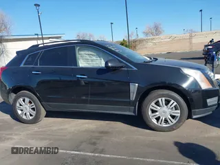 2015 Cadillac SRX z VIN 3GYFNAE32FS543933, wystawiony jako IAAI lot #41578338 z przebiegiem 150 937 mil mil oraz . Historia ofert i sprzedaży dostępna na DreamBid. Obrazek 13.