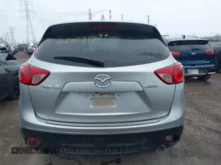 2016 Mazda CX-5 Sport with VIN JM3KE2BY5G0647715, listed as a IAAI auction lot 41831228 with 89,689 mi miles and . Bid and sale history available at carsss.com. Image 16.
