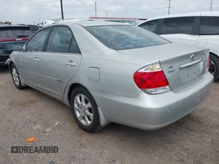 2006 Toyota Camry LE z VIN 4T1BF32K86U119208, wystawiony jako IAAI lot #42127284 z przebiegiem 99 864 mil mil oraz . Historia ofert i sprzedaży dostępna na DreamBid. Obrazek 3.