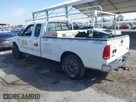 2002 Ford F-150 XL with VIN 1FTRX17L82NA54581, listed as a IAAI auction lot 41698662 with 220,321 mi miles. Bid and sale history available at carsss.com. Image 3.
