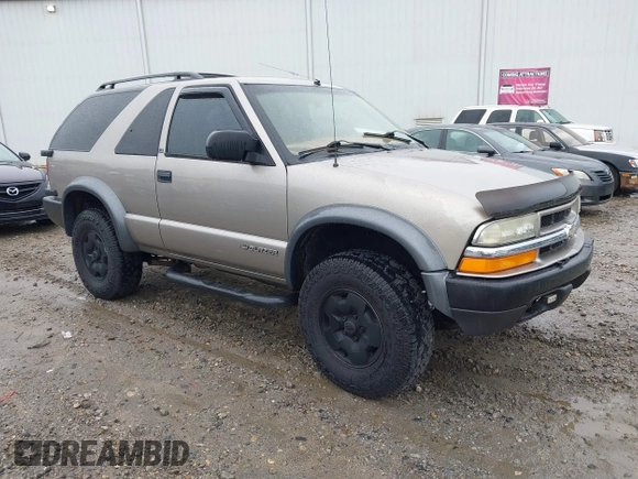 2001 Chevrolet Blazer LS z VIN 1GNCT18W11K246877, wystawiony jako IAAI lot #42375718 z przebiegiem 264 652 mil mil oraz . Historia ofert i sprzedaży dostępna na DreamBid. Obrazek 1.
