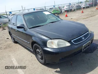 1999 Honda Civic LX with VIN JHMEJ6674XS003829, listed as a IAAI auction lot 42121298 with 238,936 mi miles. Bid and sale history available at carsss.com. Image 1.