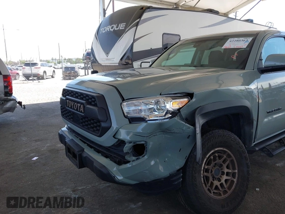 2022 Toyota Tacoma SR with VIN 3TMCZ5ANXNM479025, listed as a IAAI auction lot 42280363 with 29,650 mi miles and . Bid and sale history available at DreamBid. Image 6.