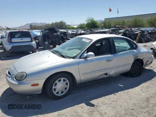 1997 Ford Taurus GL z VIN 1FALP52U0VA294061, wystawiony jako Copart lot #53323325 z przebiegiem 127 527 mil mil oraz Szkody całkowita. Historia ofert i sprzedaży dostępna na DreamBid. Obrazek 1.