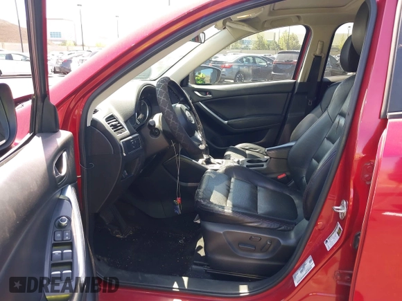 2016 Mazda CX-5 Grand Touring z VIN JM3KE2DY2G0660385, wystawiony jako IAAI lot #42101004 z przebiegiem 166 336 mil mil oraz . Historia ofert i sprzedaży dostępna na DreamBid. Obrazek 5.