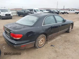 2001 Mazda Millenia z VIN JM1TA221711710228, wystawiony jako IAAI lot #41435837 z przebiegiem 152 445 mil mil oraz . Historia ofert i sprzedaży dostępna na DreamBid. Obrazek 4.