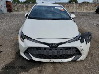 2020 Toyota Corolla Hatchback SE with VIN JTND4RBE2L3088079, listed as a Copart auction lot 75100054 with 27,730 mi miles and Salvage Title. Bid and sale history available at carsss.com. Image 5.