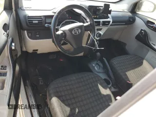 2012 Scion iQ with VIN JTNJJXB06CJ019475, listed as a Copart auction lot 61358615 with 94,194 mi miles and Clean title. Bid and sale history available at DreamBid. Image 8.