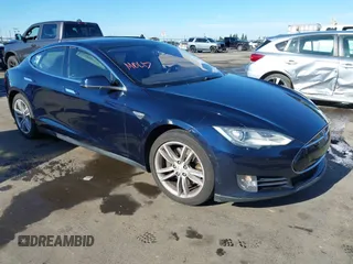 2013 Tesla Model S with VIN 5YJSA1CN5DFP23692, listed as a IAAI auction lot 41337490 with 128,000 mi miles. Bid and sale history available at carsss.com. Image 1.
