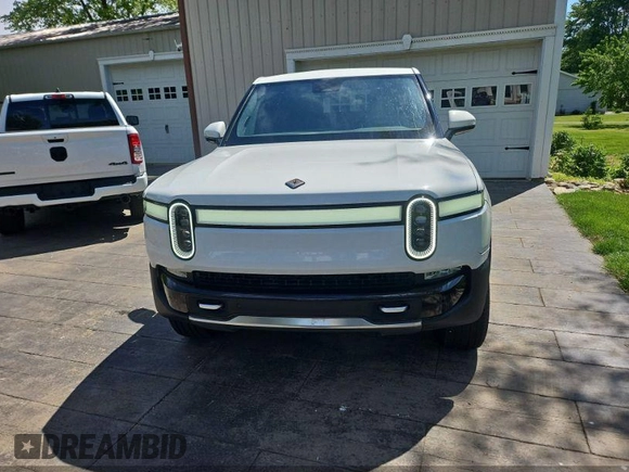 2023 Rivian R1T Adventure z VIN 7FCTGAAA1PN020478, wystawiony jako IAAI lot #42361936 z przebiegiem 443 mil mil oraz . Historia ofert i sprzedaży dostępna na DreamBid. Obrazek 6.
