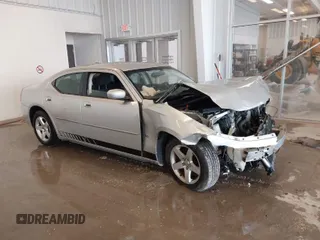 2010 Dodge Charger SXT with VIN 2B3CA3CV1AH291075, listed as a IAAI auction lot 41576216 with 144,602 mi miles. Bid and sale history available at carsss.com. Image 1.