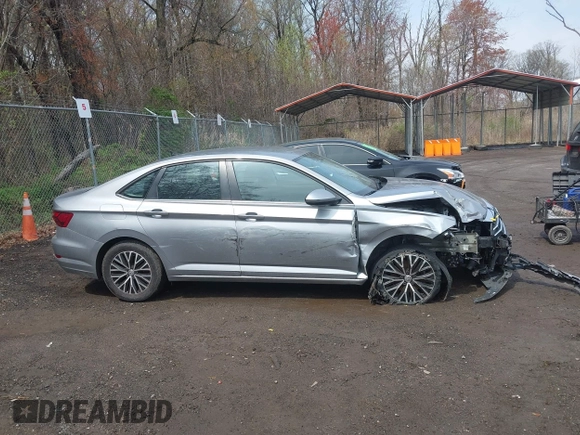 2021 Volkswagen Jetta S z VIN 3VWC57BUXMM048600, wystawiony jako IAAI lot #41956222 z przebiegiem 59 870 mil mil oraz . Historia ofert i sprzedaży dostępna na DreamBid. Obrazek 13.