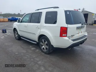 2013 Honda Pilot Touring with VIN 5FNYF4H95DB011661, listed as a IAAI auction lot 42101104 with 298,004 mi miles and . Bid and sale history available at carsss.com. Image 3.