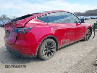 2023 Tesla Model Y Long Range with VIN 7SAYGDEE6PA157652, listed as a IAAI auction lot 41866777 with 22,584 mi miles. Bid and sale history available at carsss.com. Image 4.