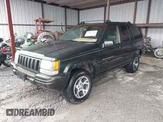 1997 Jeep Grand Cherokee Limited with VIN 1J4GZ78Y5VC723429, listed as a IAAI auction lot 42012836 with 231,126 mi miles. Bid and sale history available at carsss.com. Image 17.