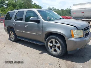 2007 Chevrolet Tahoe LT z VIN 1GNFC130X7R263516, wystawiony jako IAAI lot #42259629 z przebiegiem 215 970 mil mil oraz . Historia ofert i sprzedaży dostępna na DreamBid. Obrazek 1.