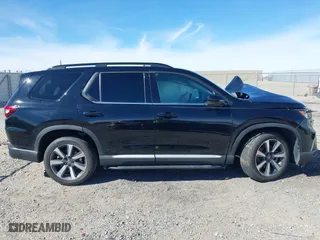 2023 Honda Pilot Elite with VIN 5FNYG1H80PB007959, listed as a IAAI auction lot 41677282 with 28,892 mi miles. Bid and sale history available at carsss.com. Image 13.