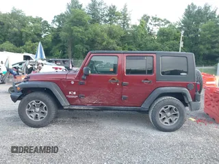 2008 Jeep Wrangler Unlimited X z VIN 1J4GA39128L568988, wystawiony jako IAAI lot #42445403 z przebiegiem 198 032 mil mil oraz . Historia ofert i sprzedaży dostępna na DreamBid. Obrazek 14.