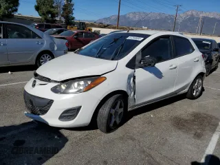 2013 Mazda Mazda2 Sport with VIN JM1DE1KZ2D0163761, listed as a Copart auction lot 87268604 with 126,697 mi miles and Salvage Title. Bid and sale history available at carsss.com. Image 1.