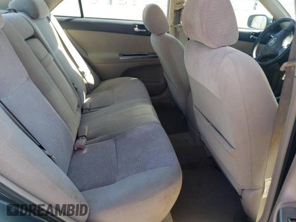 2003 Toyota Camry LE z VIN 4T1BF32K63U559665, wystawiony jako Copart lot #52147645 z przebiegiem 322 212 mil mil oraz Szkoda całkowita • Salvage title. Historia ofert i sprzedaży dostępna na DreamBid. Obrazek 10.