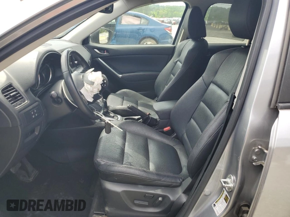 2014 Mazda CX-5 Grand Touring with VIN JM3KE4DY9E0416967, listed as a Copart auction lot 54215285 with 77,296 mi miles and Salvage Title. Bid and sale history available at DreamBid. Image 7.