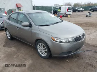 2012 Kia Forte EX with VIN KNAFU4A24C5632655, listed as a IAAI auction lot 41932379 with 146,273 mi miles. Bid and sale history available at carsss.com. Image 1.
