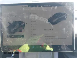 2023 Tesla Model Y Long Range with VIN 7SAYGAEE9PF905943, listed as a IAAI auction lot 41444255 with 11,179 mi miles and . Bid and sale history available at DreamBid. Image 7.