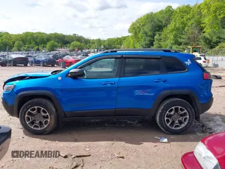 2020 Jeep Cherokee Trailhawk with VIN 1C4PJMBXXLD636547, listed as a IAAI auction lot 42314654 with 59,061 mi miles and . Bid and sale history available at DreamBid. Image 14.