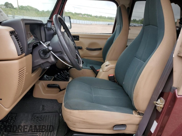 2002 Jeep Wrangler Sahara with VIN 1J4FA59S32P746410, listed as a Copart auction lot 56403075 with 147,968 mi miles and Salvage title. Bid and sale history available at DreamBid. Image 7.