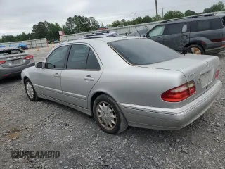 2000 Mercedes-Benz E 320 with VIN WDBJF65J1YB099417, listed as a Copart auction lot 54656915 with 130,387 mi miles and Salvage Title. Bid and sale history available at DreamBid. Image 2.