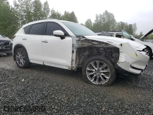 2019 Mazda CX-5 Grand Touring with VIN JM3KFBDM4K0669589, listed as a Copart auction lot 54948455 with 64,475 mi miles and Salvage Title. Bid and sale history available at carsss.com. Image 4.
