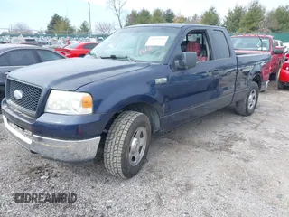2005 Ford F-150 XLT with VIN 1FTPX12565NA61341, listed as a IAAI auction lot 41693609 with 401,988 mi miles. Bid and sale history available at carsss.com. Image 2.