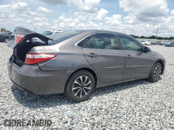 2015 Toyota Camry XLE with VIN 4T4BF1FK5FR461977, listed as a Copart auction lot 55680985 with 104,588 mi miles and Salvage Title. Bid and sale history available at DreamBid. Image 3.