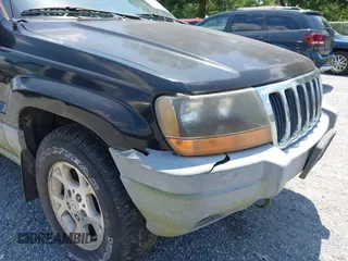 2000 Jeep Grand Cherokee Laredo with VIN 1J4GW48N7YC357376, listed as a IAAI auction lot 42503429 with 211,154 mi miles and . Bid and sale history available at DreamBid. Image 12.