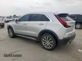 2021 Cadillac XT4 FWD Premium Luxury z VIN 1GYFZCR42MF004233, wystawiony jako Copart lot #57229385 z przebiegiem 98 387 mil mil oraz Szkody całkowita. Historia ofert i sprzedaży dostępna na DreamBid. Obrazek 2.