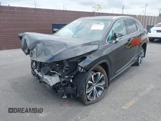 2022 Lexus RX with VIN 2T2HGMDA1NC090258, listed as a IAAI auction lot 36253855 with 8,565 mi miles. Bid and sale history available at carsss.com. Image 2.