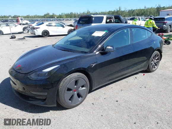 2023 Tesla Model 3 with VIN 5YJ3E1EAXPF623403, listed as a IAAI auction lot 41829543 with 29,414 mi miles and . Bid and sale history available at carsss.com. Image 2.