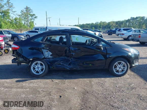 2019 Ford Fiesta SE z VIN 3FADP4BJ2KM159022, wystawiony jako IAAI lot #42269813 z przebiegiem 55 107 mil mil oraz . Historia ofert i sprzedaży dostępna na DreamBid. Obrazek 13.