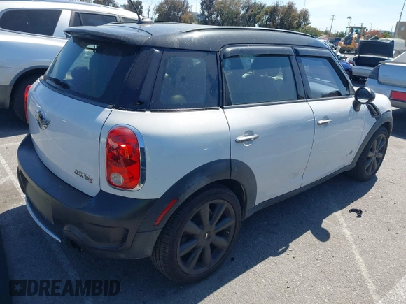 2012 MINI Countryman S with VIN WMWZC5C54CWM11869, listed as a IAAI auction lot 42265935 with 100,102 mi miles and . Bid and sale history available at DreamBid. Image 4.