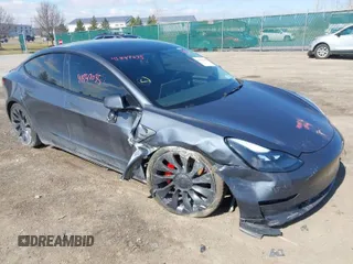 2023 Tesla Model 3 Performance with VIN 5YJ3E1EC4PF633961, listed as a IAAI auction lot 41847035 with 29,935 mi miles. Bid and sale history available at carsss.com. Image 1.