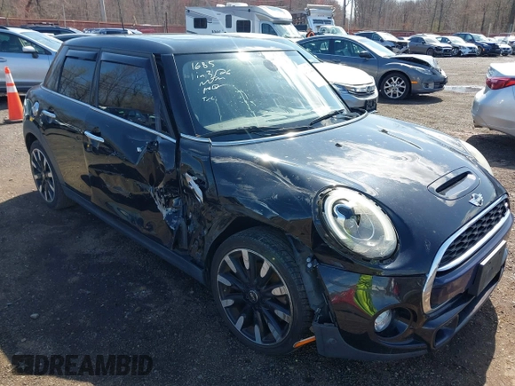 2017 MINI Hardtop 4 Door Cooper S z VIN WMWXU3C39H2F48699, wystawiony jako IAAI lot #41924423 z przebiegiem 81 249 mil mil oraz . Historia ofert i sprzedaży dostępna na DreamBid. Obrazek 6.
