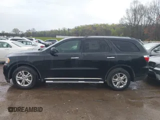 2013 Dodge Durango Crew with VIN 1C4RDHDG5DC613835, listed as a IAAI auction lot 41910643 with 155,827 mi miles and . Bid and sale history available at DreamBid. Image 14.