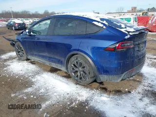 2022 Tesla Model X Plaid z VIN 7SAXCBE69NF343318, wystawiony jako IAAI lot #41387403 z przebiegiem Nie podano mil oraz . Historia ofert i sprzedaży dostępna na DreamBid. Obrazek 3.