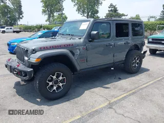 2020 Jeep Wrangler Unlimited Rubicon with VIN 1C4HJXFG3LW279636, listed as a IAAI auction lot 42430354 with 19,631 mi miles and . Bid and sale history available at DreamBid. Image 2.