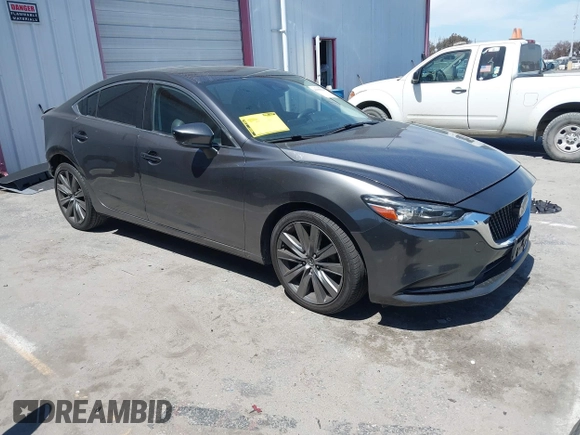 2018 Mazda Mazda6 Touring with VIN JM1GL1VM1J1320592, listed as a IAAI auction lot 41985616 with 100,920 mi miles. Bid and sale history available at carsss.com. Image 1.