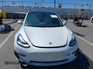 2019 Tesla Model 3 Mid Range with VIN 5YJ3E1EA5KF327181, listed as a IAAI auction lot 41860943 with 157,335 mi miles and . Bid and sale history available at DreamBid. Image 12.