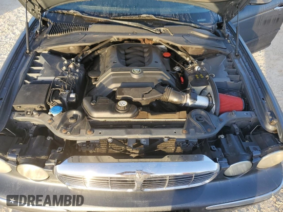 2004 Jaguar XJ with VIN SAJEA74C24SG09038, listed as a Copart auction lot 77015544 with Not Provided miles and Salvage Title. Bid and sale history available at DreamBid. Image 11.
