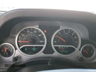 2009 Jeep Wrangler Sahara with VIN 1J4FA54149L708183, listed as a Copart auction lot 65989125 with 133,436 mi miles and Salvage title. Bid and sale history available at DreamBid. Image 9.