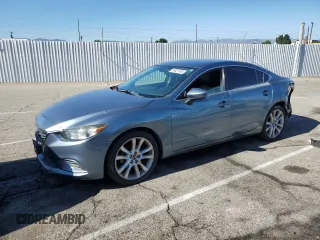 2014 Mazda 6 i Touring with VIN JM1GJ1V69E1136014, listed as a Copart auction lot 65027245 with Not provided miles and Salvage title. Bid and sale history available at DreamBid. Image 1.